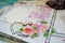 Handmade scrapbooking, wedding photo album. Carvings with pink flowers, ornaments, words, flying, lace, wooden hearts and