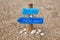 Handmade signpost on the tropical beach in