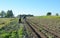 Handmade small tractor plowing field. Old tractor plowing on the farmland