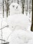 Handmade snowman closeup in snow-covered city park