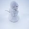Handmade snowman in snow