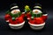 Handmade snowmen figurines isolated on black background. Christmas decoration.