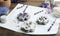 Handmade soap bars with lavender flowers in metal forms and ingredients on wooden table