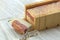 Handmade soap being cut using a wire cutter on marble backdrop