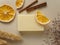 Handmade soap, dried plants, orange slices and cinnamon on beige background