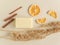 Handmade soap, dried plants, orange slices and cinnamon on beige background