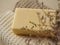 Handmade soap, towels and dried flowers on beige background