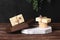 Handmade soap on wood podium on wooden background