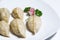 Handmade steamed dumplings on white plate, homemade cooked jiaozi, Chinese food