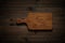 Handmade teak wooden chopping board on wood table, wooden chopping board texture background.
