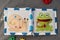 Handmade textile book for baby on gray background. Pages with funny felt snail and frog. Woolly toys teaching to use zipper.
