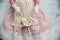 Handmade toy blonde angel in red lace dress bakery