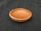 Handmade Traditional Clay or Sand Brown Color Bowl, Pot Lid  on a Black Background