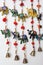 Handmade wind chimes with bells and small decorated toy elephant