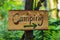Handmade wooden camping sign in forest