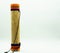 Handmade wooden rain stick standing on a white background on the left side of the image. Concept percussion instruments