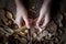 Handmade wooden utensils, top view female hands carve a wooden spoon with stock-knife, selective focus