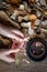 Handmade wooden utensils, top view female hands carve a wooden spoon with stock-knife, selective focus