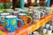 handpainted mugs on a vibrant market stall display