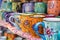 handpainted mugs on a vibrant market stall display