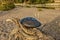 Handpan with sea and beach at sunset. Hang is a musical instrument for meditation.