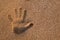 Handprint in the sand