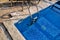 Handrail on pool. Swimming pool with stair at tropical resort. Pool handrails view. Water swimming pool with sunny reflection.