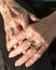 Hands of an 80 year old woman showing off her rings