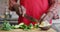 Hands of african american senior man cutting vegetables