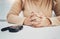 Hands, anxiety and diabetes with a woman waiting for the results of a test while sitting at a table. Healthcare, blood