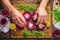 hands arranging goat cheese on beetroot slices