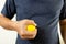 Hands of asian male holding a stress ball,man patient doing hand and wrist exercise,training with rubber ball,squeeze for muscle