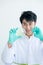 Hands of Asian scientist man use forceps hold pieces of Aloe Vera and prepare to put in glass plate to do some experiment in