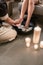 Hands of an Asian therapist during foot washing treatment