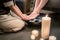 Hands of an Asian therapist during foot washing treatment