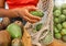 Hands, avocado and bag with a woman customer shopping in a grocery store for a health diet or nutrition. Supermarket