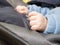 Hands of a baby fist, selective focus, the child is in the stroller