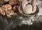 Hands of a baker kneading dough in a bowl