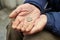 Hands of beggar with penny coin begging for money