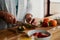 Hands of biracial elderly female chopping strawberries in modern kitchen. Preparing healthy meal for breakfast.