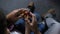 Hands of boy with help of dad collect puzzle cube