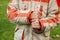 Hands of boy in jacket hold umbrella handle