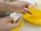 Hands break a raw egg. Separation of egg white from yolk