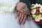 Hands of the bride and groom with wedding rings, the couple