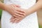 Hands of the bride with a ring and manicure close-up