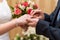 Hands of the bride with a ring during the wedding in the registry office wedding ceremony