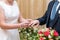 Hands of the bride with a ring during the wedding in the registry office wedding ceremony