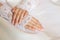 Hands of a bride with a wedding manicure