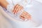 Hands of a bride with a wedding manicure