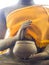 Hands of Buddha statue in posture of begging with alms bowl